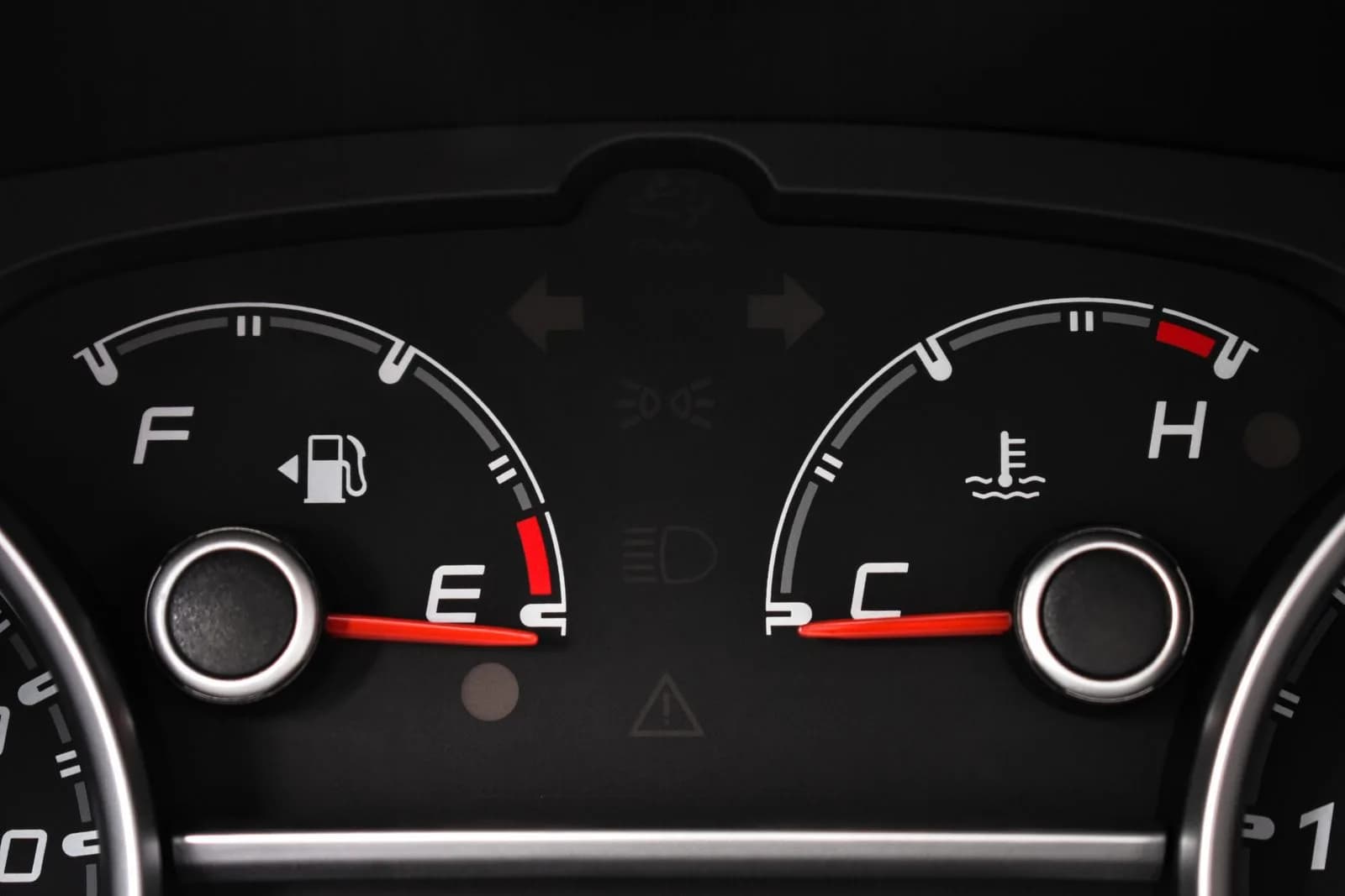 A commercial truck being refueled at a fuel island while a driver holds a fuel card