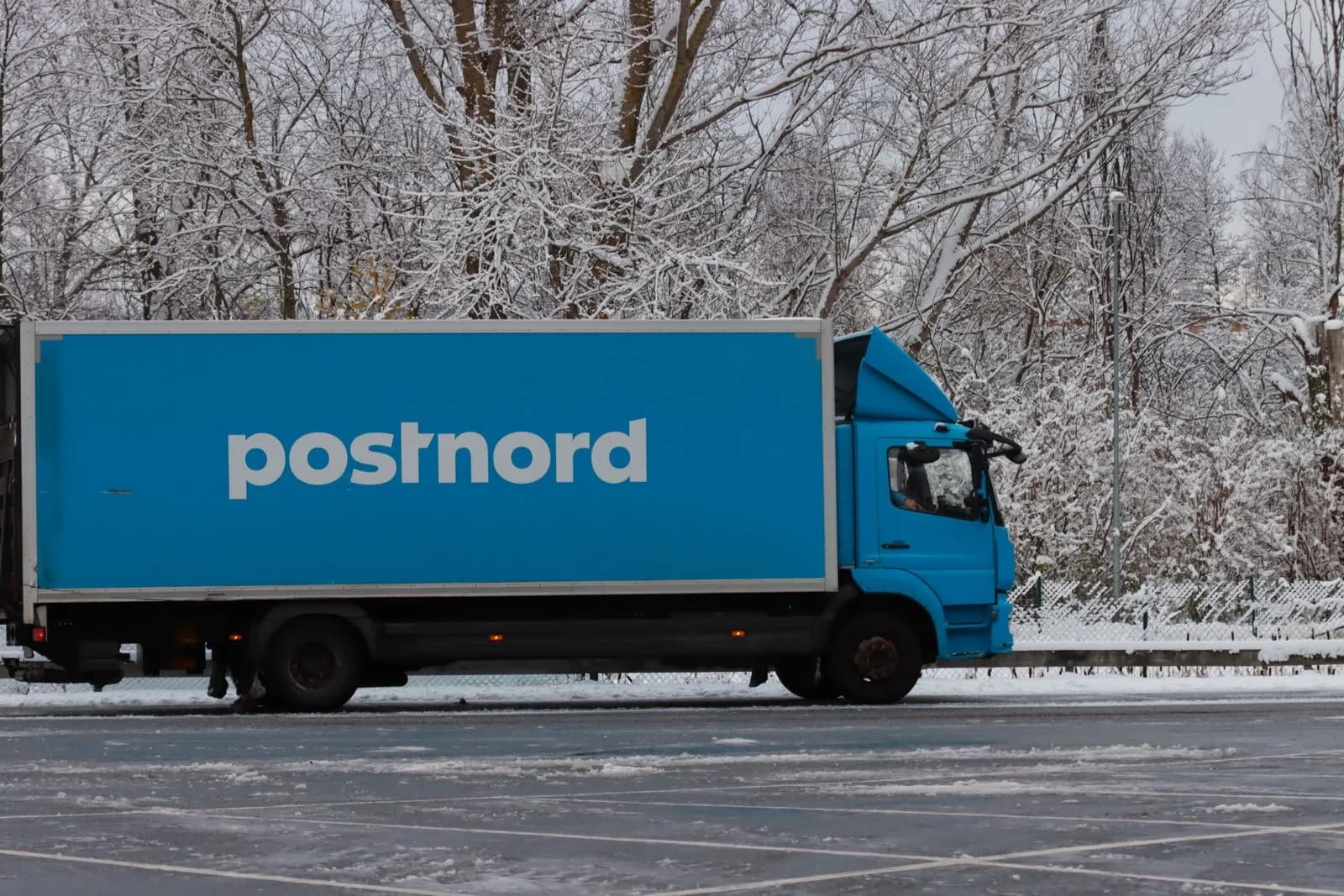 A row of parked commercial delivery trucks