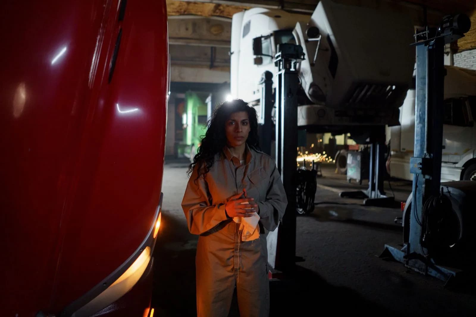 A technician servicing a commercial truck engine