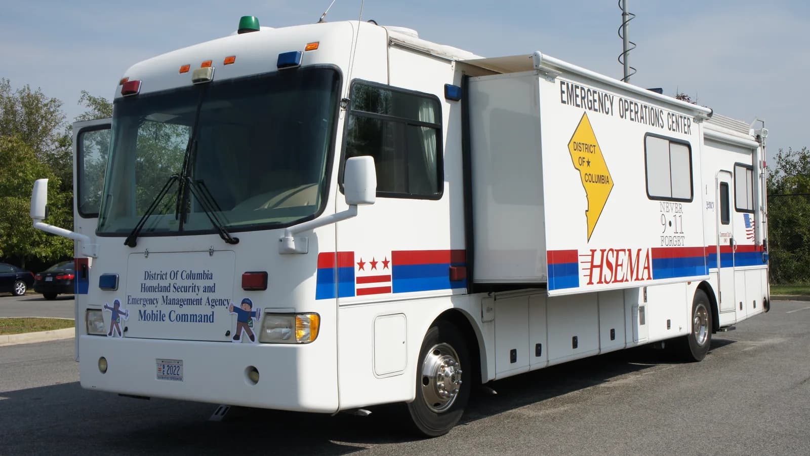 A mobile command centre vehicle parked at an emergency staging area