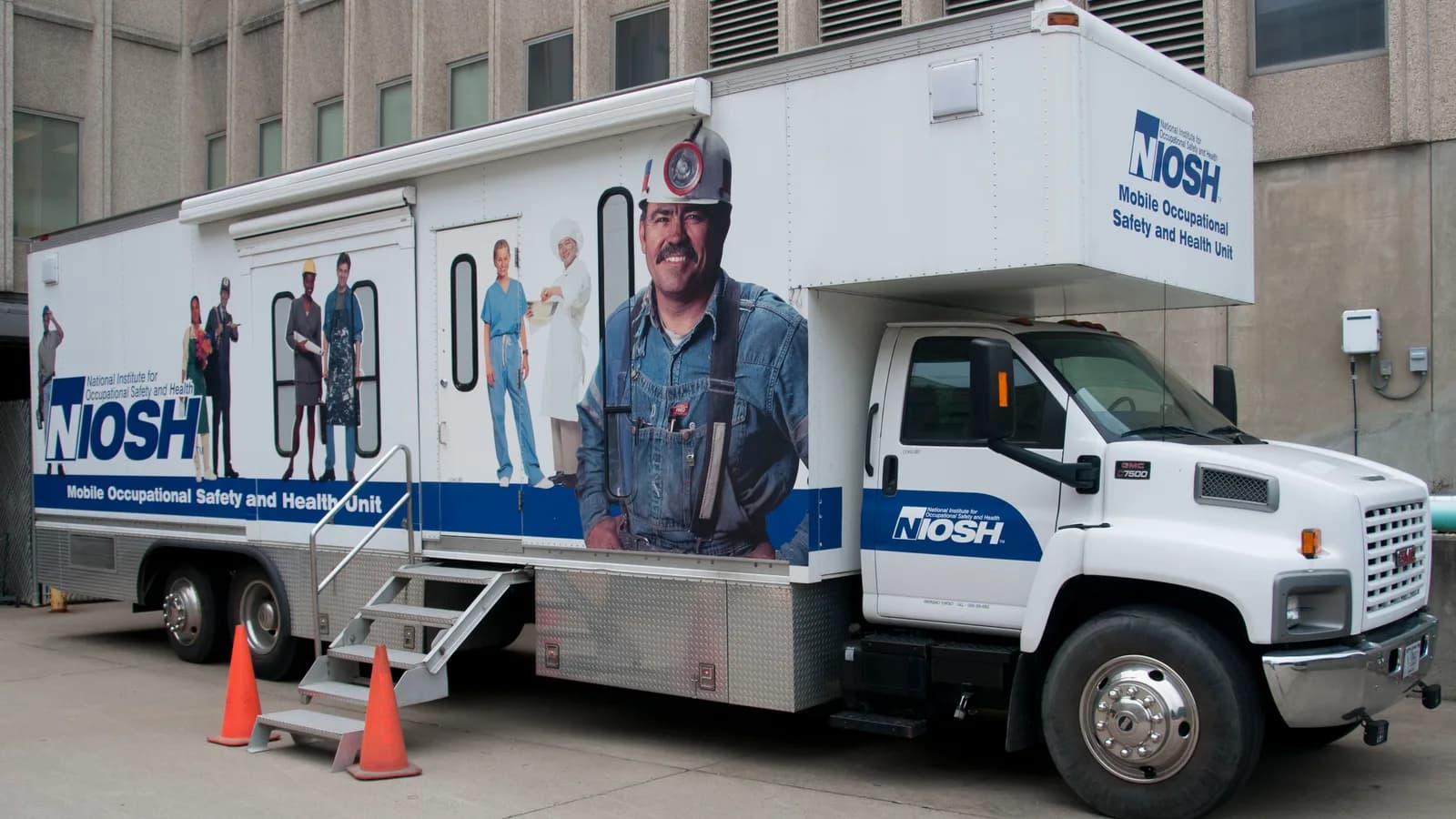 A mobile health clinic truck with its side stairs deployed