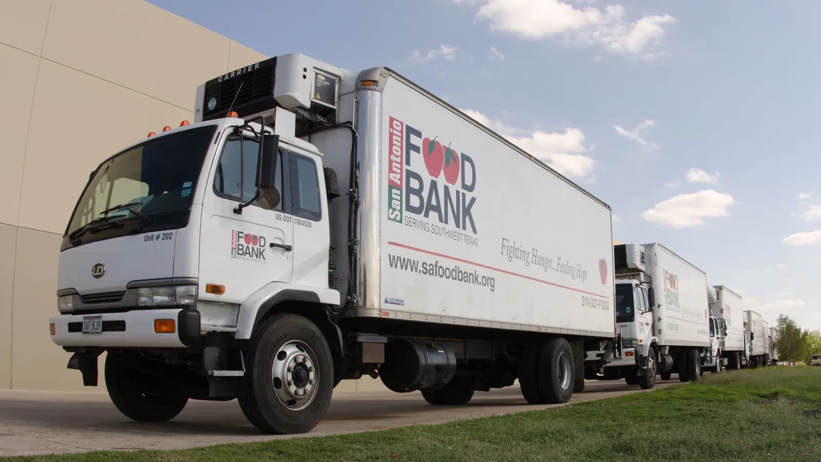 A food bank refrigerated truck parked in a lot