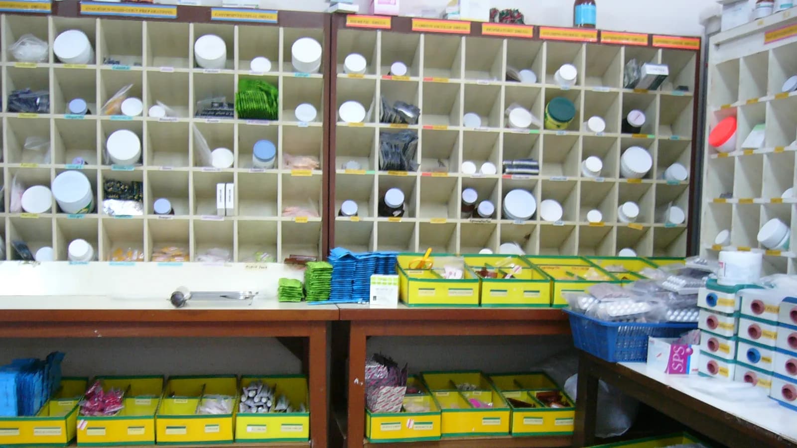 Shelves of packaged medicines in a pharmacy stockroom