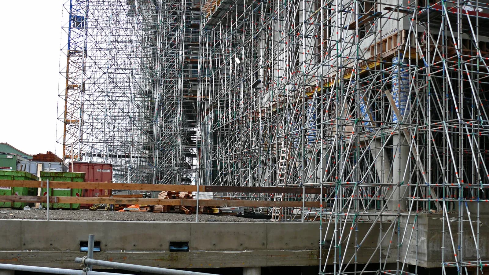Scaffolding erected across the face of a building under construction