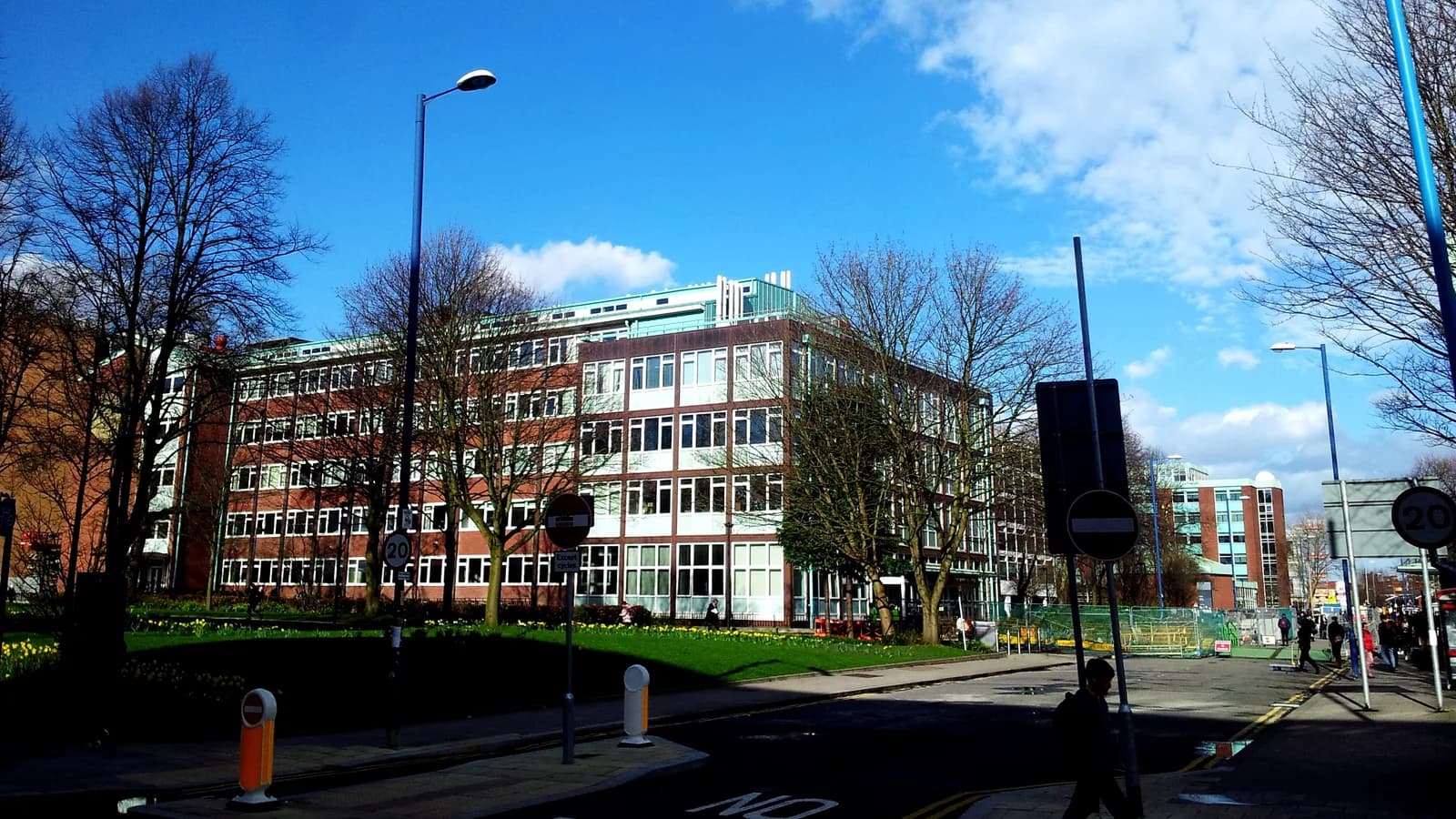 A school building seen from the street on a clear day