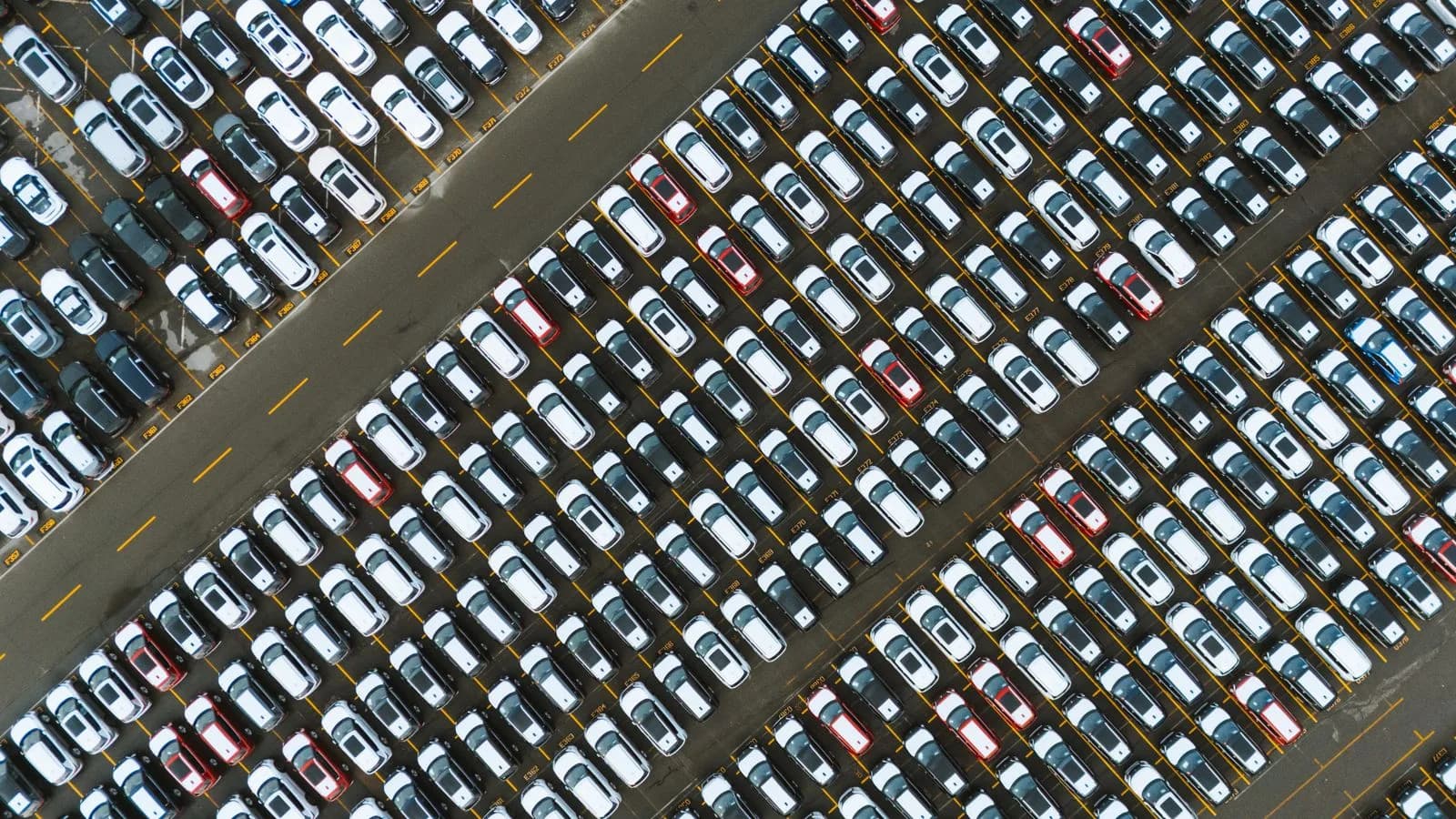 An aerial view of a commercial fleet parked in a yard