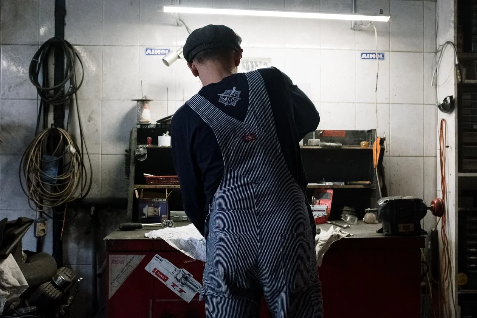 A tradesperson working in a commercial vehicle repair garage